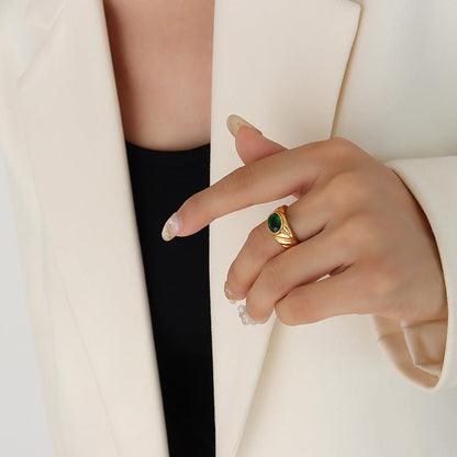 Gold ring with white and green diamonds