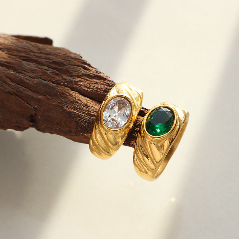 Gold ring with white and green diamonds