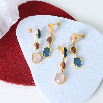 Gold earrings with colored crystals